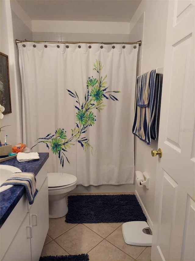 455 Eagle Dr, Kissimmee, FL 34759 - bathroom with tile patterned floors, toilet, vanity, and shower / bath combo with shower curtain