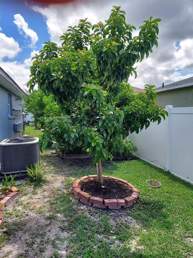 455 Eagle Dr, Kissimmee, FL 34759 - view of yard with central air condition unit