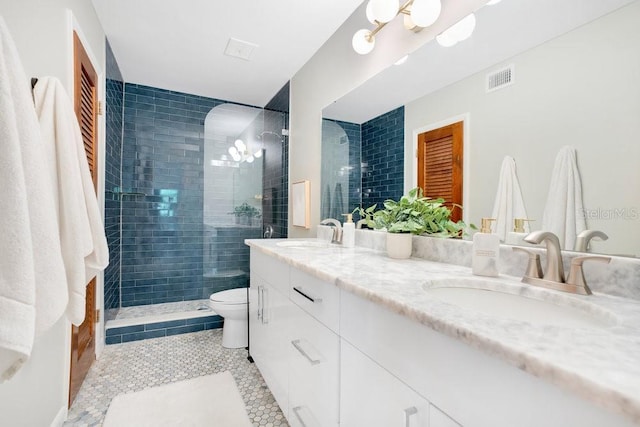 312 Palencia Pl, Lakeland, FL 33803 - bathroom featuring double vanity, tile patterned floors, and tiled shower