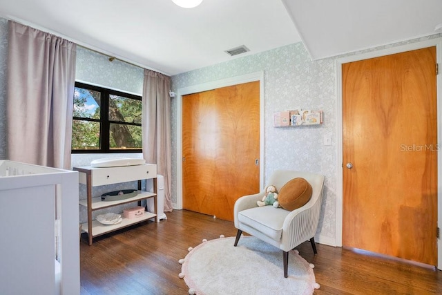 312 Palencia Pl, Lakeland, FL 33803 - sitting room featuring wallpapered walls and wood finished floors