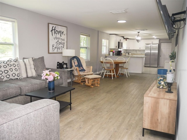 355 E Columbia St, Lake Alfred, FL 33850 - living room with light wood-style flooring