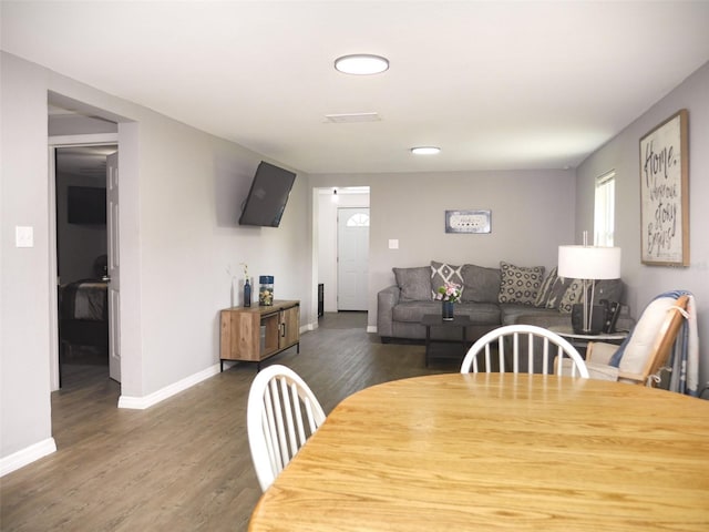 355 E Columbia St, Lake Alfred, FL 33850 - dining area featuring wood finished floors and baseboards
