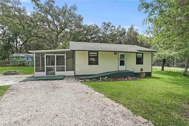 633 Glenda St, Lakeland, FL 33805 - view of front of house with a sunroom and a fire pit