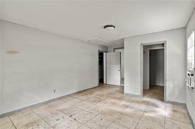 633 Glenda St, Lakeland, FL 33805 - unfurnished bedroom featuring baseboards, attic access, and light tile patterned flooring