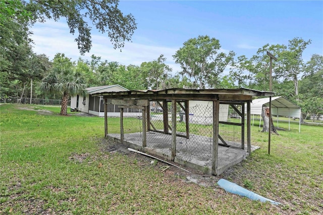 633 Glenda St, Lakeland, FL 33805 - view of green lawn featuring a detached carport