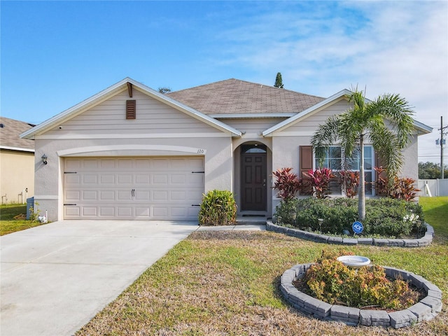 view of front facade with concrete driveway, a garage, a shingled roof, stucco siding, and a front yard