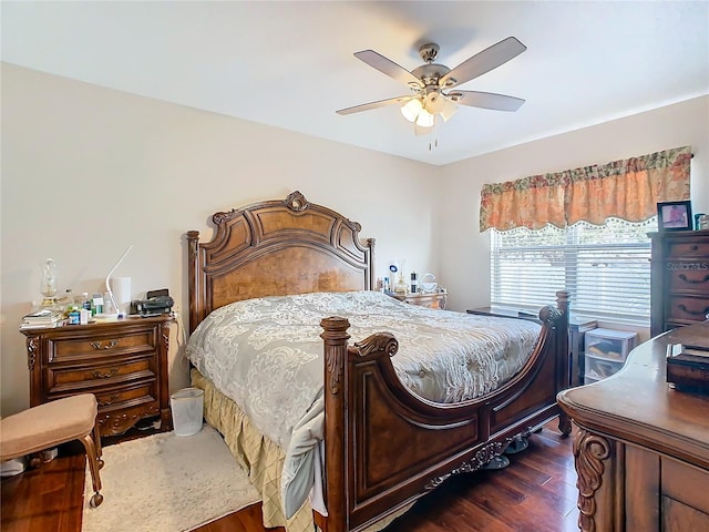 bedroom featuring dark wood-style flooring and a ceiling fan