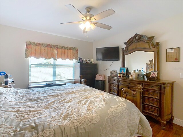 bedroom with wood finished floors and a ceiling fan