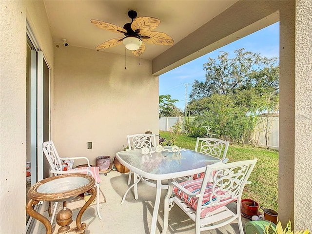 view of patio / terrace featuring outdoor dining area and a ceiling fan