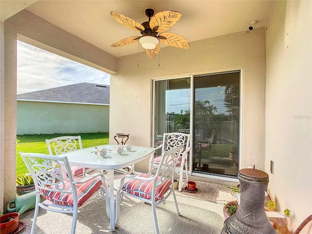 view of patio / terrace featuring outdoor dining area and ceiling fan