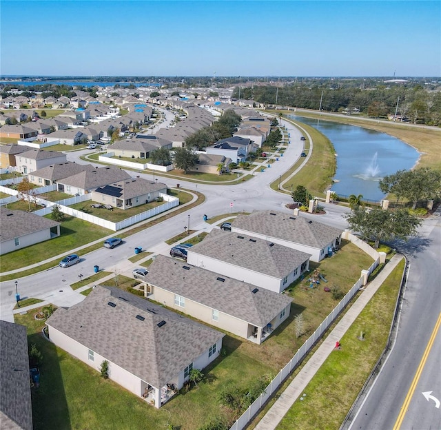 aerial view of residential area with a large body of water