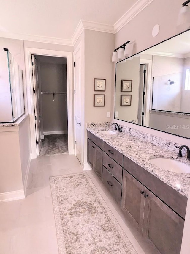 7919 Lake James Blvd, Lakeland, FL 33810 - full bathroom with ornamental molding, double vanity, baseboards, a walk in closet, and walk in shower
