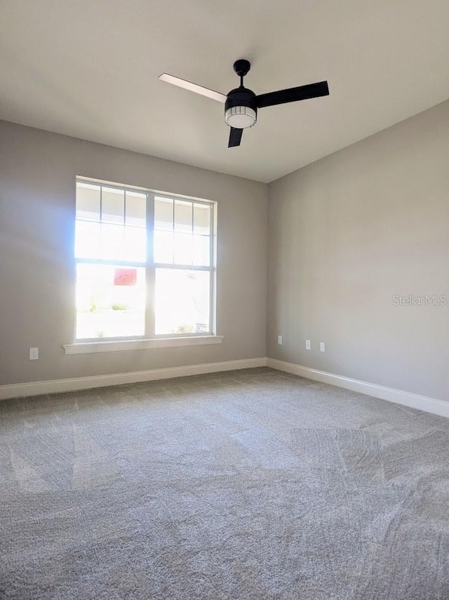 7919 Lake James Blvd, Lakeland, FL 33810 - carpeted empty room with ceiling fan and baseboards