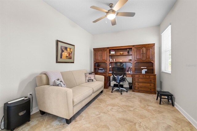 3136 Langdon Ln, Winter Haven, FL 33884 - home office with a ceiling fan and baseboards