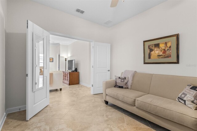 3136 Langdon Ln, Winter Haven, FL 33884 - living room with a ceiling fan, baseboards, and light tile patterned floors