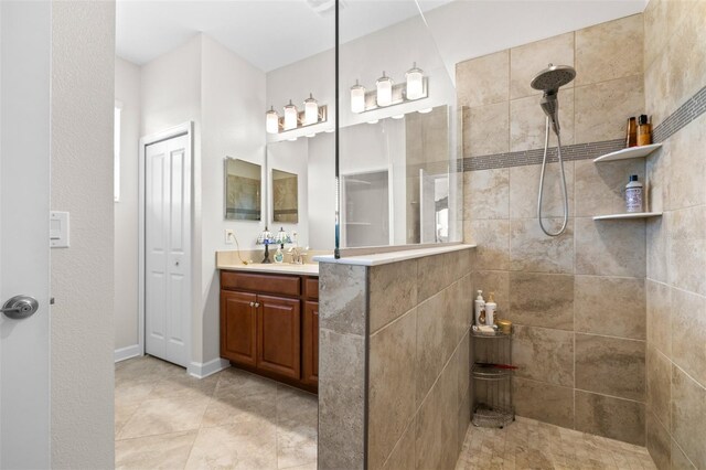 3136 Langdon Ln, Winter Haven, FL 33884 - bathroom with vanity, a walk in shower, and tile patterned flooring
