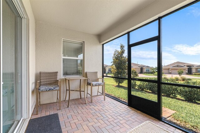 3136 Langdon Ln, Winter Haven, FL 33884 - sunroom featuring a residential view
