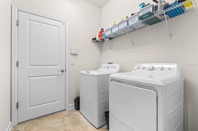 3136 Langdon Ln, Winter Haven, FL 33884 - washroom featuring washer and dryer and baseboards