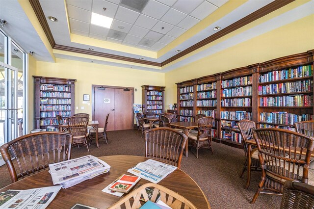 3136 Langdon Ln, Winter Haven, FL 33884 - carpeted office with a tray ceiling, crown molding, and bookshelves