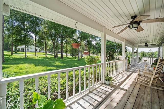 9912 Pine Leaf Ln, Dade City, FL 33525 - porch with a ceiling fan and a lawn