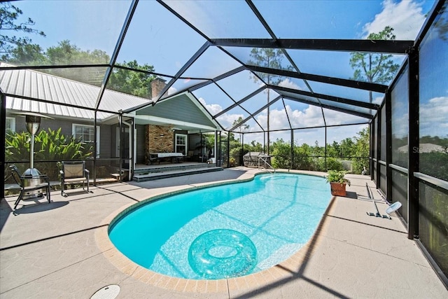 9912 Pine Leaf Ln, Dade City, FL 33525 - outdoor pool featuring a patio and a lanai