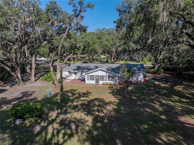 view of yard with view of wooded area