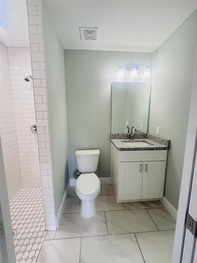 1329 Tom Watson Rd, Lakeland, FL 33801 - full bath with toilet, vanity, tiled shower, and baseboards