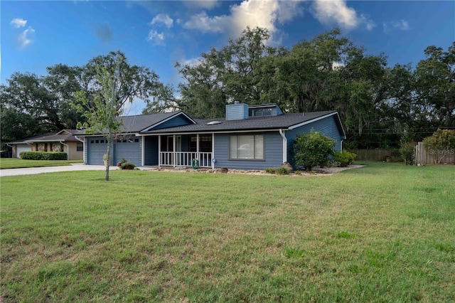 1920 Indian Trails Ct, Lakeland, FL 33813 - ranch-style house with a garage, a porch, a chimney, and driveway