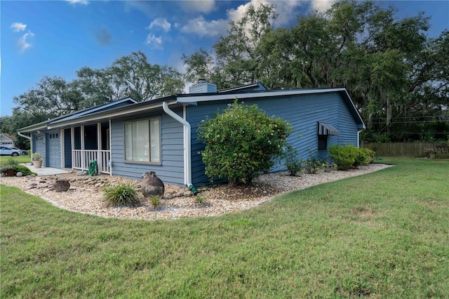 1920 Indian Trails Ct, Lakeland, FL 33813 - view of side of property with a yard and a chimney