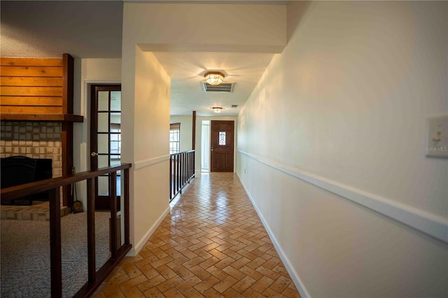 1920 Indian Trails Ct, Lakeland, FL 33813 - hallway featuring baseboards and brick flooring