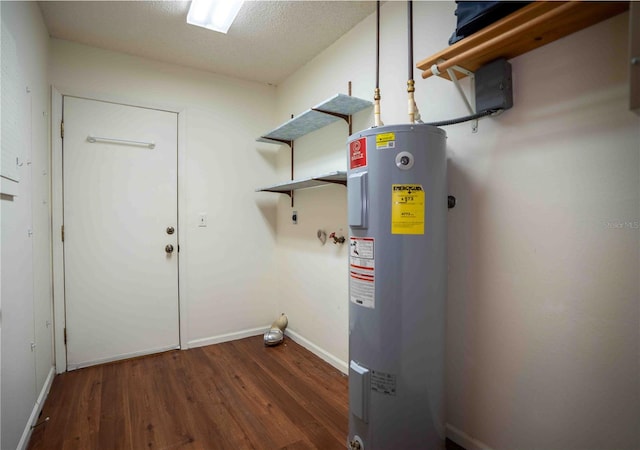 1920 Indian Trails Ct, Lakeland, FL 33813 - laundry room featuring electric water heater, wood finished floors, baseboards, and hookup for an electric dryer