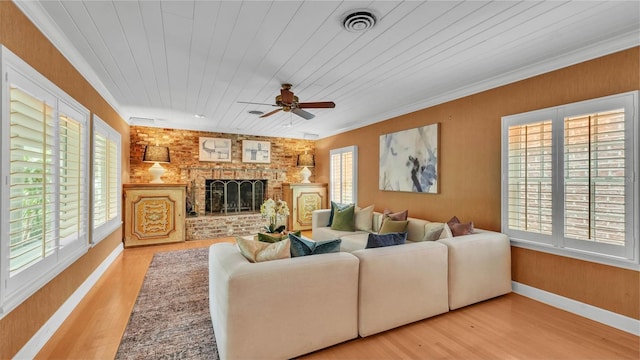 323 E Belvedere St, Lakeland, FL 33803 - living area featuring healthy amount of natural light, wood finished floors, wood ceiling, ceiling fan, and a fireplace