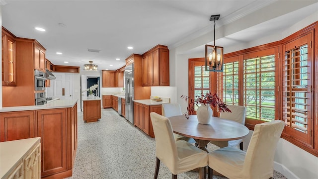 323 E Belvedere St, Lakeland, FL 33803 - dining space featuring a chandelier, recessed lighting, crown molding, and dark aggregate flooring