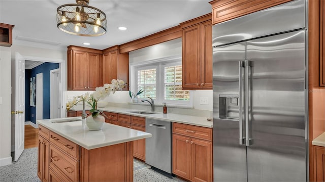 323 E Belvedere St, Lakeland, FL 33803 - kitchen with appliances with stainless steel finishes, a sink, light countertops, recessed lighting, and brown cabinetry
