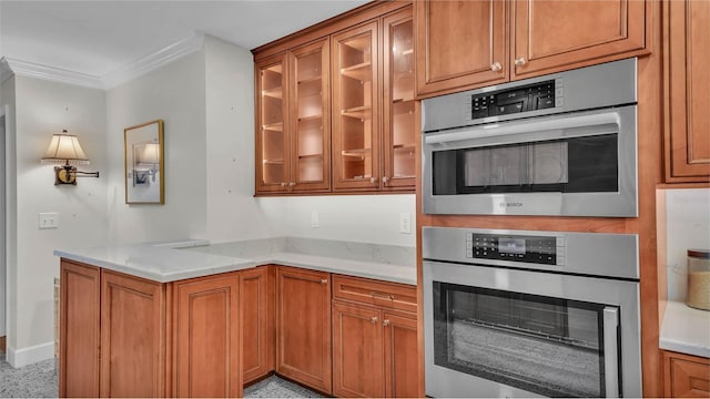 323 E Belvedere St, Lakeland, FL 33803 - kitchen with oven, crown molding, brown cabinets, glass insert cabinets, and light stone countertops