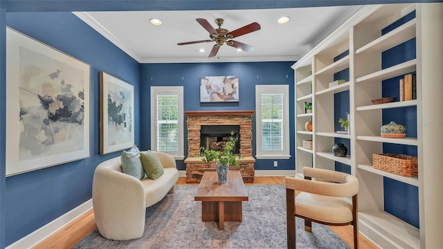 323 E Belvedere St, Lakeland, FL 33803 - sitting room with baseboards, ceiling fan, wood finished floors, a fireplace, and recessed lighting