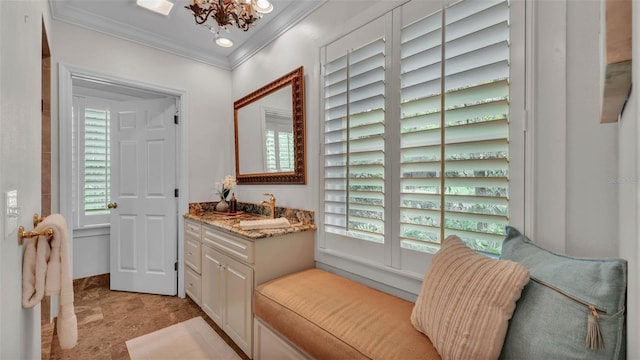 323 E Belvedere St, Lakeland, FL 33803 - bathroom with crown molding, vanity, and a chandelier