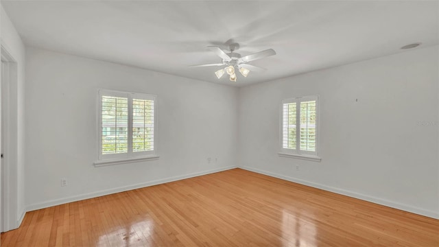 323 E Belvedere St, Lakeland, FL 33803 - spare room with light wood-type flooring, baseboards, and ceiling fan