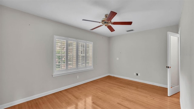 323 E Belvedere St, Lakeland, FL 33803 - spare room featuring light wood-style floors, a ceiling fan, and baseboards