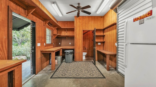 323 E Belvedere St, Lakeland, FL 33803 - unfurnished office with unfinished concrete flooring, wood walls, and ceiling fan