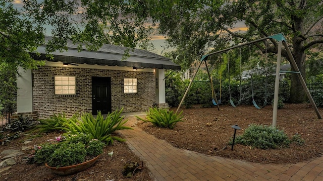 323 E Belvedere St, Lakeland, FL 33803 - yard at dusk featuring a playground