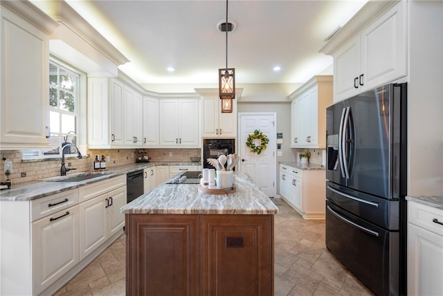 5425 Charlin Ave, Lakeland, FL 33810 - kitchen with black appliances, a sink, stone tile flooring, backsplash, and recessed lighting