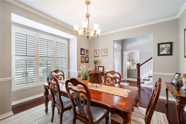 5425 Charlin Ave, Lakeland, FL 33810 - dining room with a chandelier, wood finished floors, ornamental molding, stairs, and baseboards