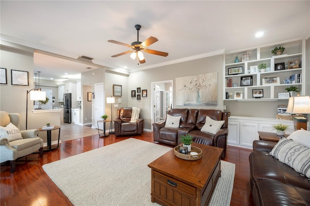 5425 Charlin Ave, Lakeland, FL 33810 - living area with a ceiling fan, dark wood-style floors, and ornamental molding