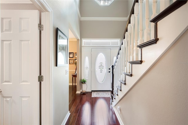 5425 Charlin Ave, Lakeland, FL 33810 - foyer entrance featuring stairs, dark wood finished floors, baseboards, and crown molding