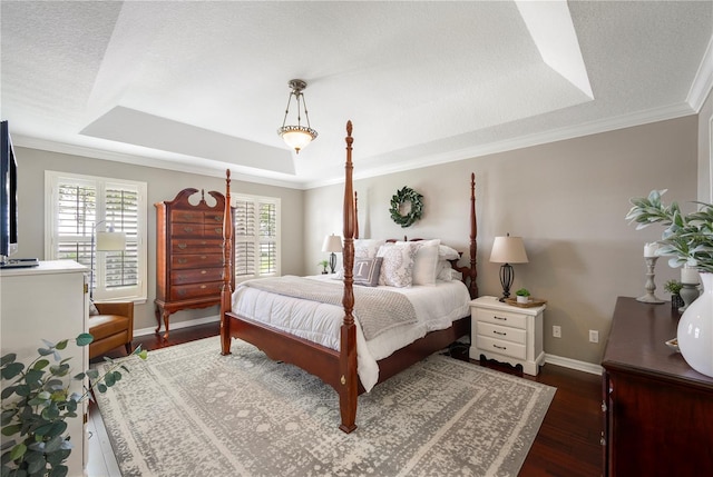 5425 Charlin Ave, Lakeland, FL 33810 - bedroom featuring a raised ceiling, wood finished floors, baseboards, crown molding, and a textured ceiling