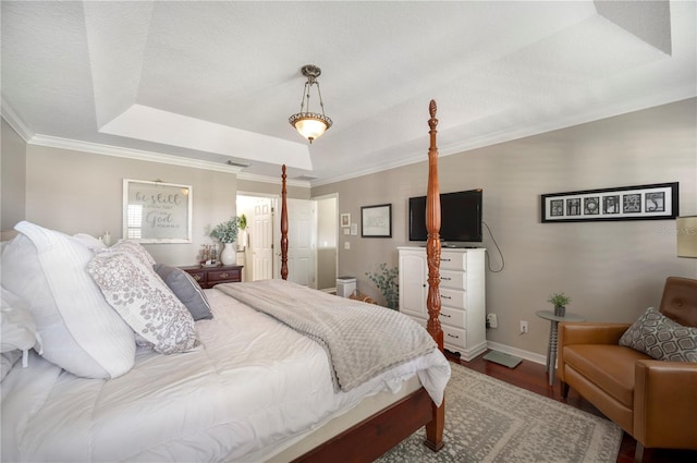 5425 Charlin Ave, Lakeland, FL 33810 - bedroom featuring a tray ceiling, wood finished floors, ornamental molding, and baseboards