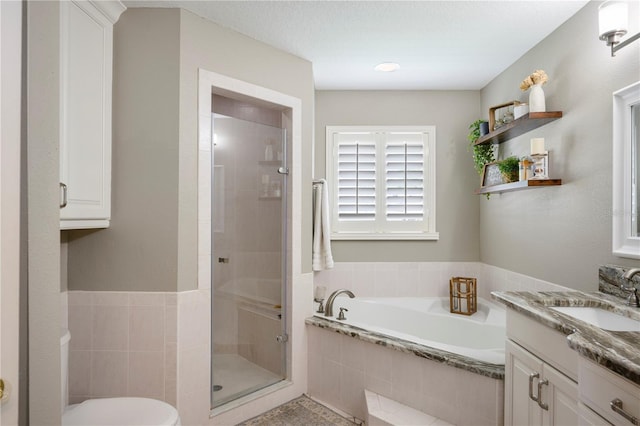 5425 Charlin Ave, Lakeland, FL 33810 - bathroom with vanity, a bath, a shower stall, and toilet
