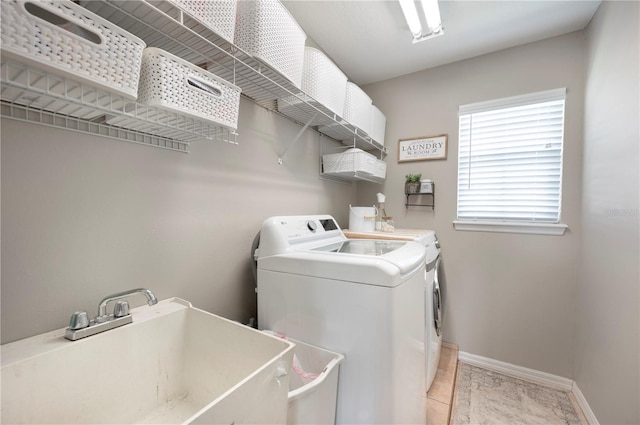 5425 Charlin Ave, Lakeland, FL 33810 - washroom featuring washing machine and dryer and baseboards