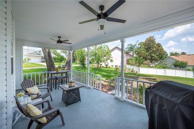 5425 Charlin Ave, Lakeland, FL 33810 - covered porch featuring a ceiling fan, area for grilling, and a lawn